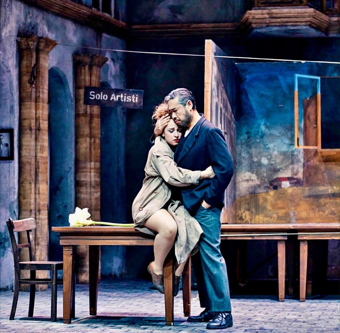 An embrace on stage